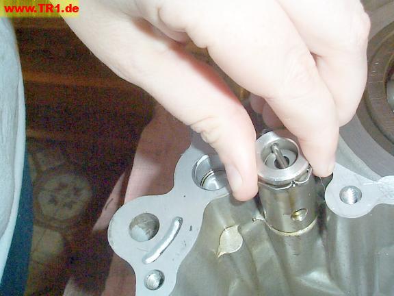Disembodied fingers pull out oil pressure relief valve